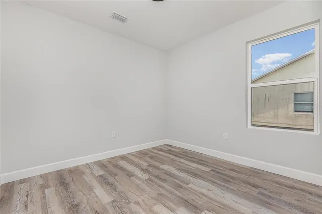 a view of room with window and closet