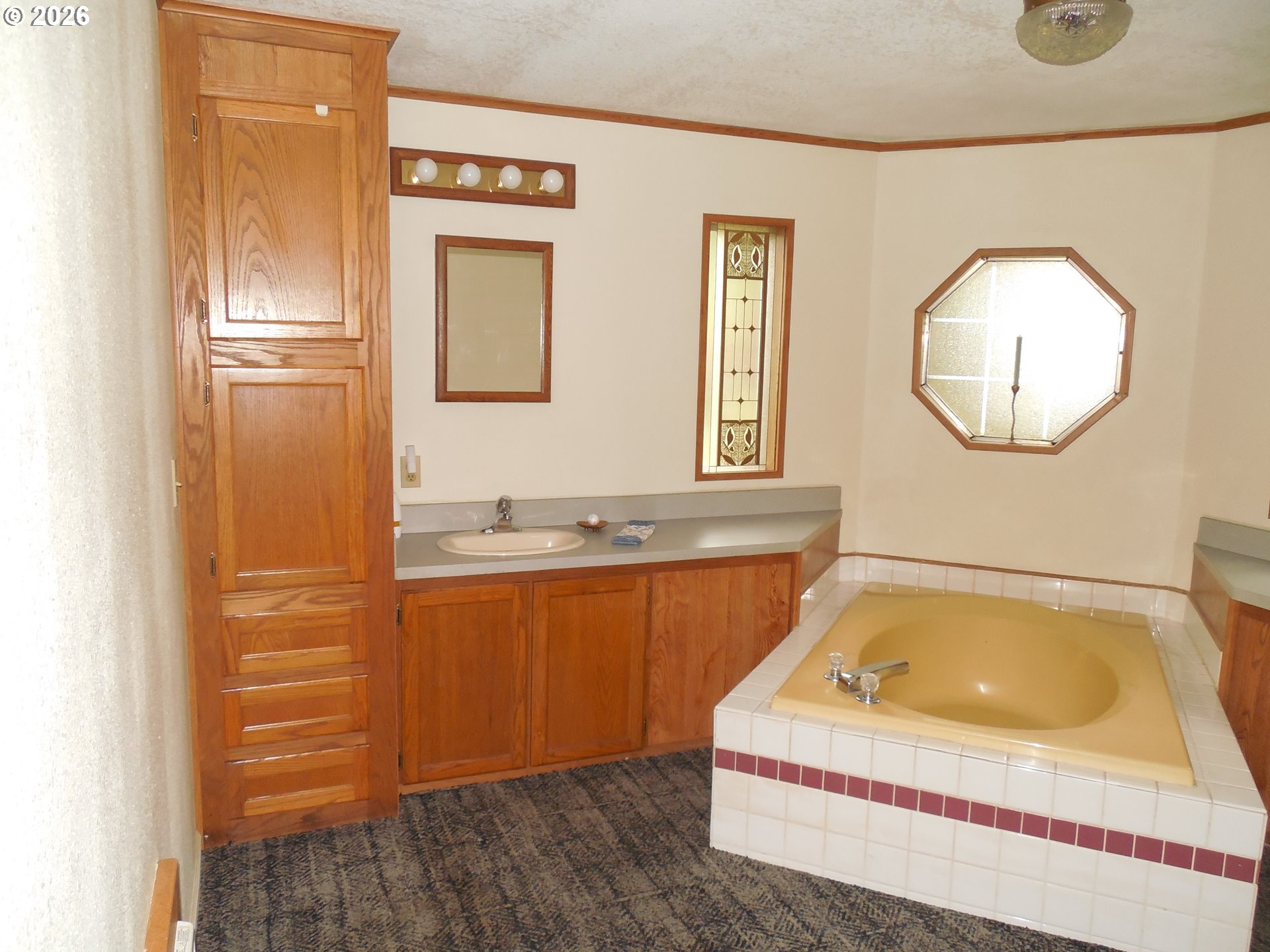41180 Southeast Kubitz Road Sandy, OR 97055 - Photo 38 of 38 a bathroom with a tub sink and mirror