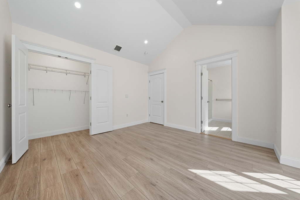 3 Spotted Turtle Path, Unit 242 Canton, MA 02021 - Photo 13 of 36 a view of an empty room with wooden floor
