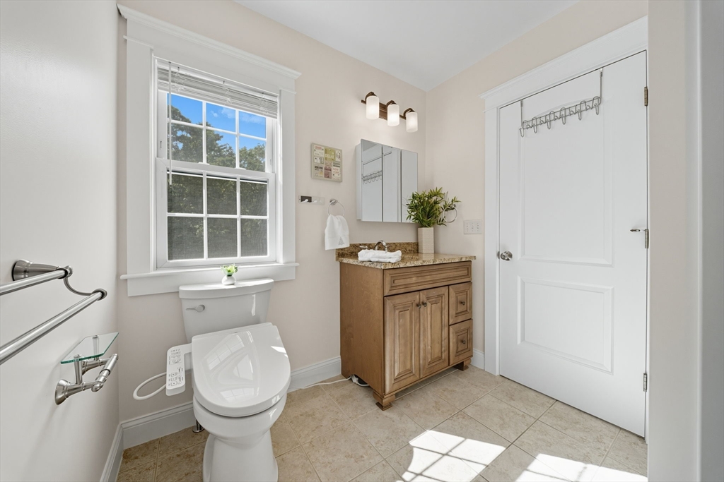 3 Spotted Turtle Path, Unit 242 Canton, MA 02021 - Photo 15 of 36 a bathroom with a granite countertop sink toilet and shower