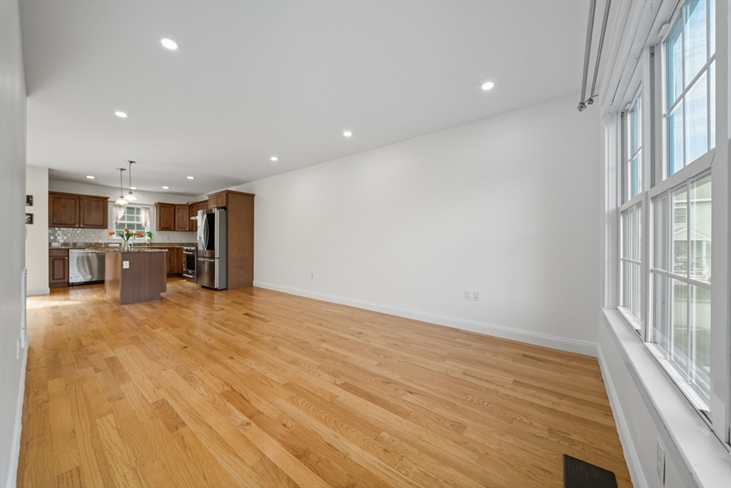 3 Spotted Turtle Path, Unit 242 Canton, MA 02021 - Photo 24 of 36 a view of a kitchen with a sink and a refrigerator