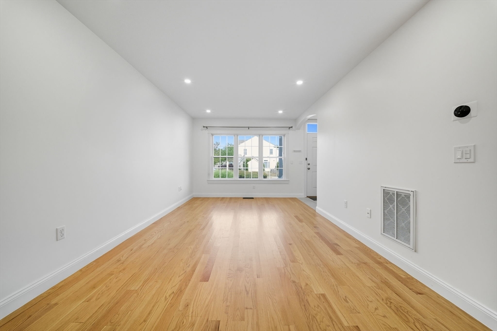 3 Spotted Turtle Path, Unit 242 Canton, MA 02021 - Photo 25 of 36 wooden floor in an empty room with a window