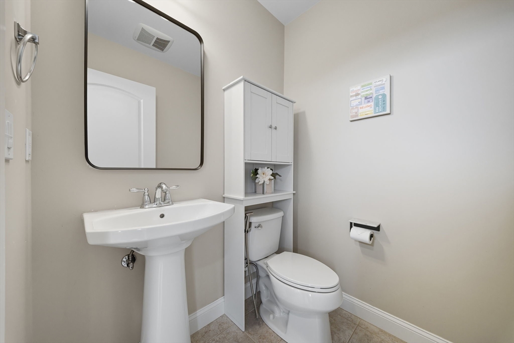 3 Spotted Turtle Path, Unit 242 Canton, MA 02021 - Photo 26 of 36 a bathroom with a sink toilet and mirror