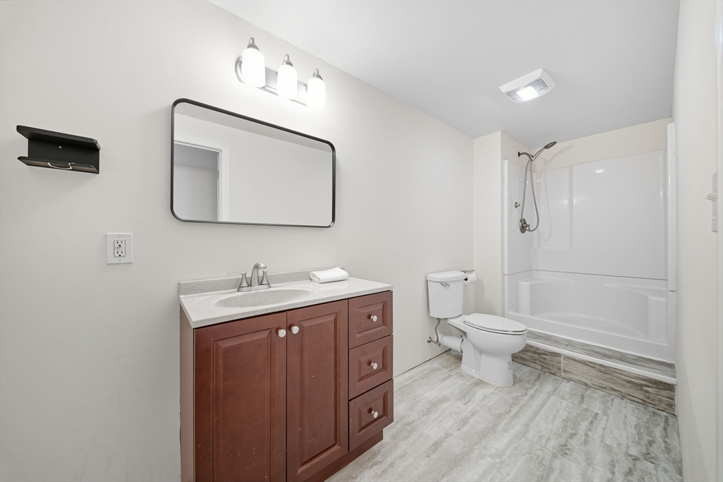 3 Spotted Turtle Path, Unit 242 Canton, MA 02021 - Photo 30 of 36 a bathroom with a toilet a sink and mirror