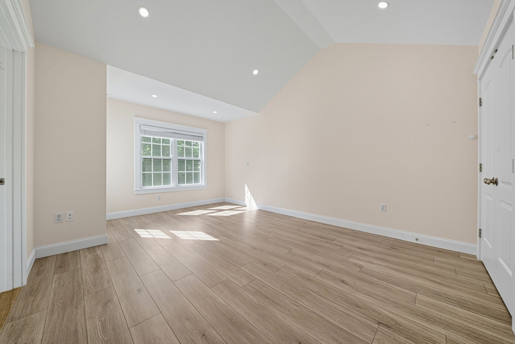3 Spotted Turtle Path, Unit 242 Canton, MA 02021 - Photo 10 of 36 an empty room with wooden floor and windows