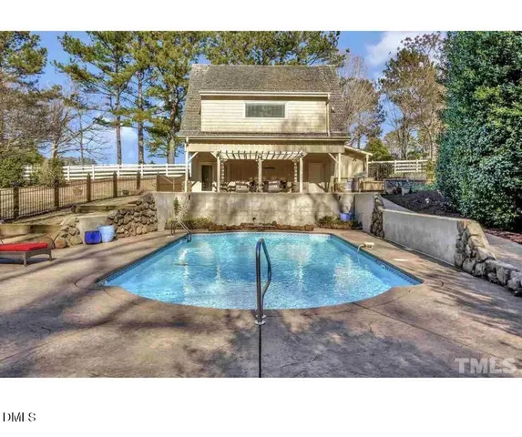 a outdoor living space with patio furniture and a fireplace