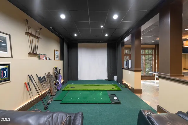 a living room with furniture and a dresser