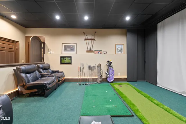 a large bathroom with a tub a sink a mirror and a shower