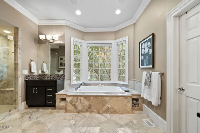 a kitchen with stainless steel appliances granite countertop a sink a stove and cabinets