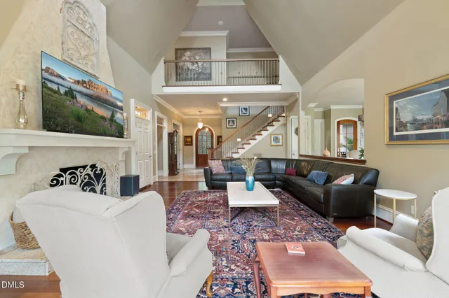 a kitchen with granite countertop white cabinets and a window