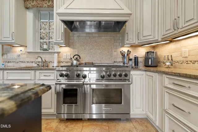 a room with granite countertop lots of different kinds of food