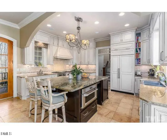 a outdoor living space with patio furniture and a fireplace