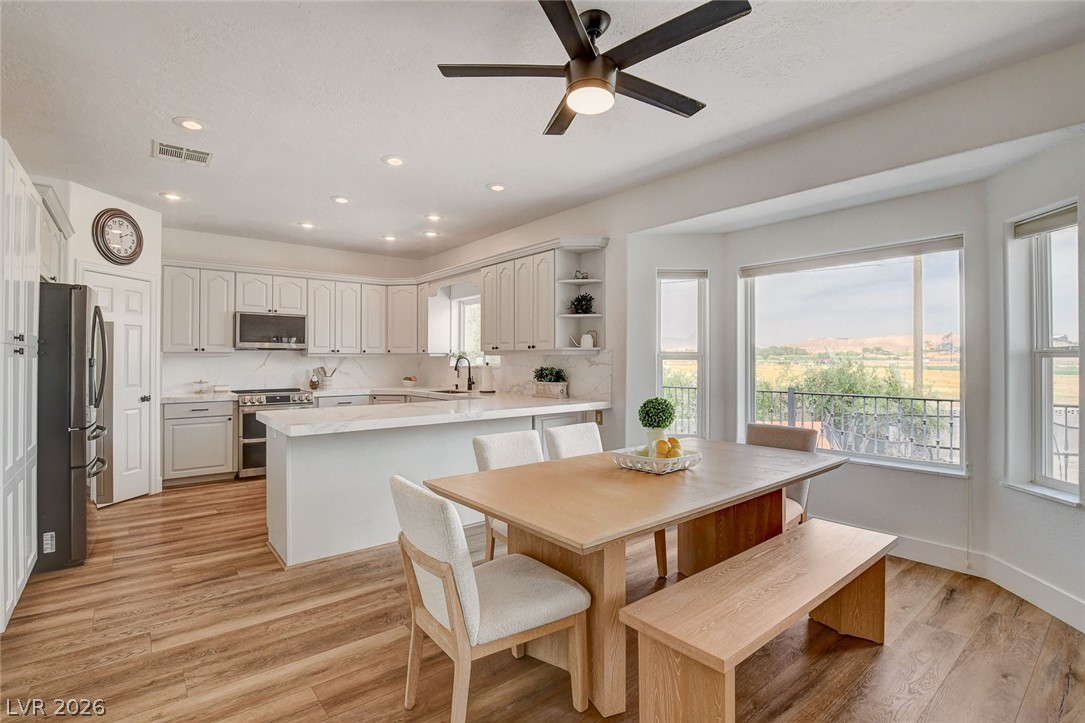 4362 Thistle Street Logandale, NV 89021 - Photo 14 of 99 A well-lit kitchen with a large bay window offers picturesque views of the surrounding landscape.