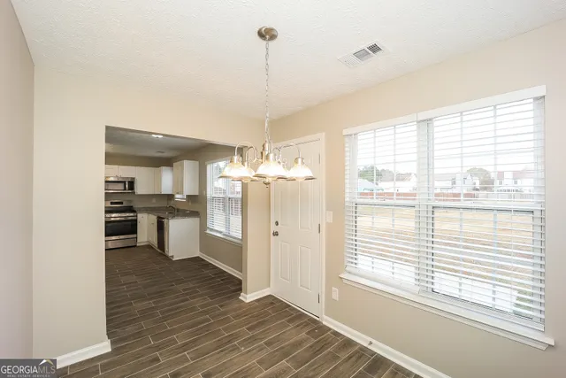 a view of a kitchen and a dishwasher cabinets