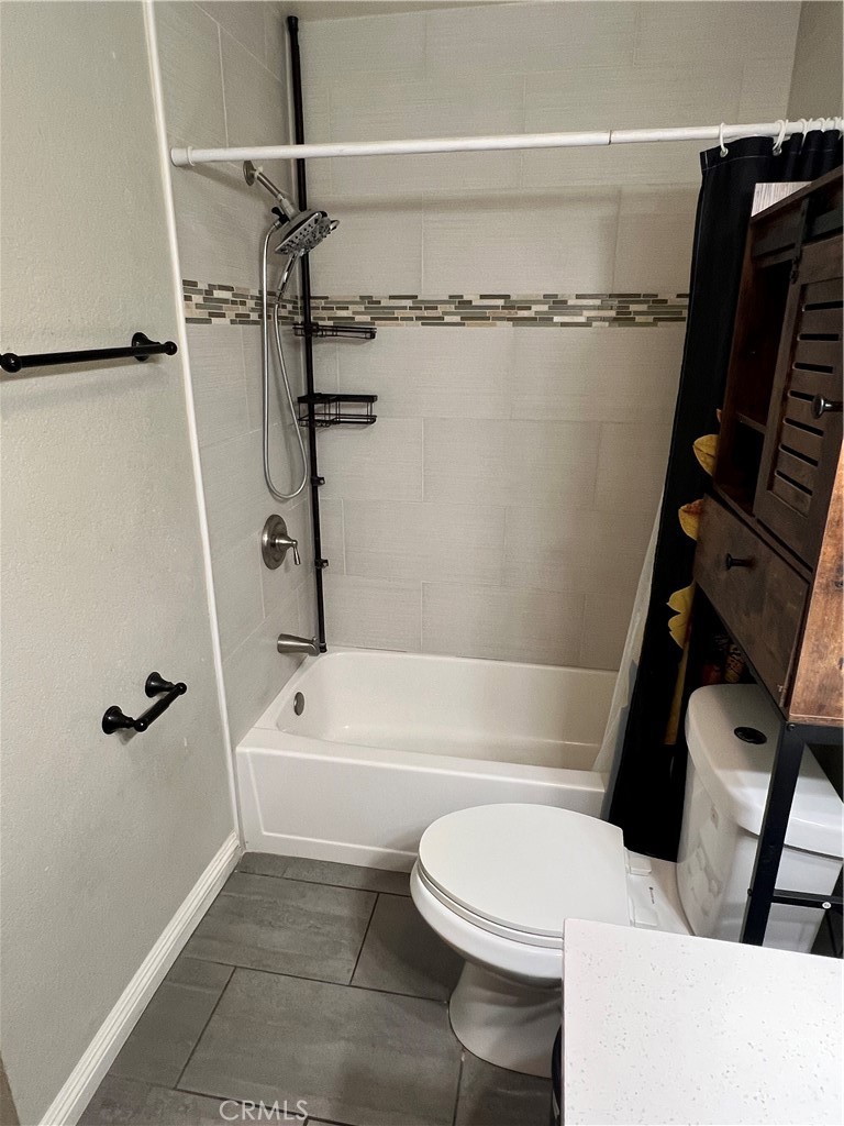 866 North Eucalyptus Avenue Rialto, CA 92376 - Photo 15 of 20 a bathroom with a toilet and a shower