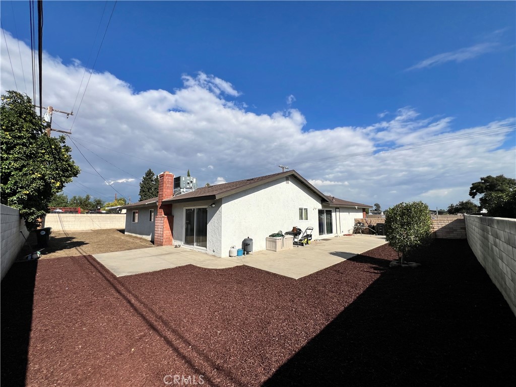 866 North Eucalyptus Avenue Rialto, CA 92376 - Photo 18 of 20 a view of a house with backyard porch and sitting area