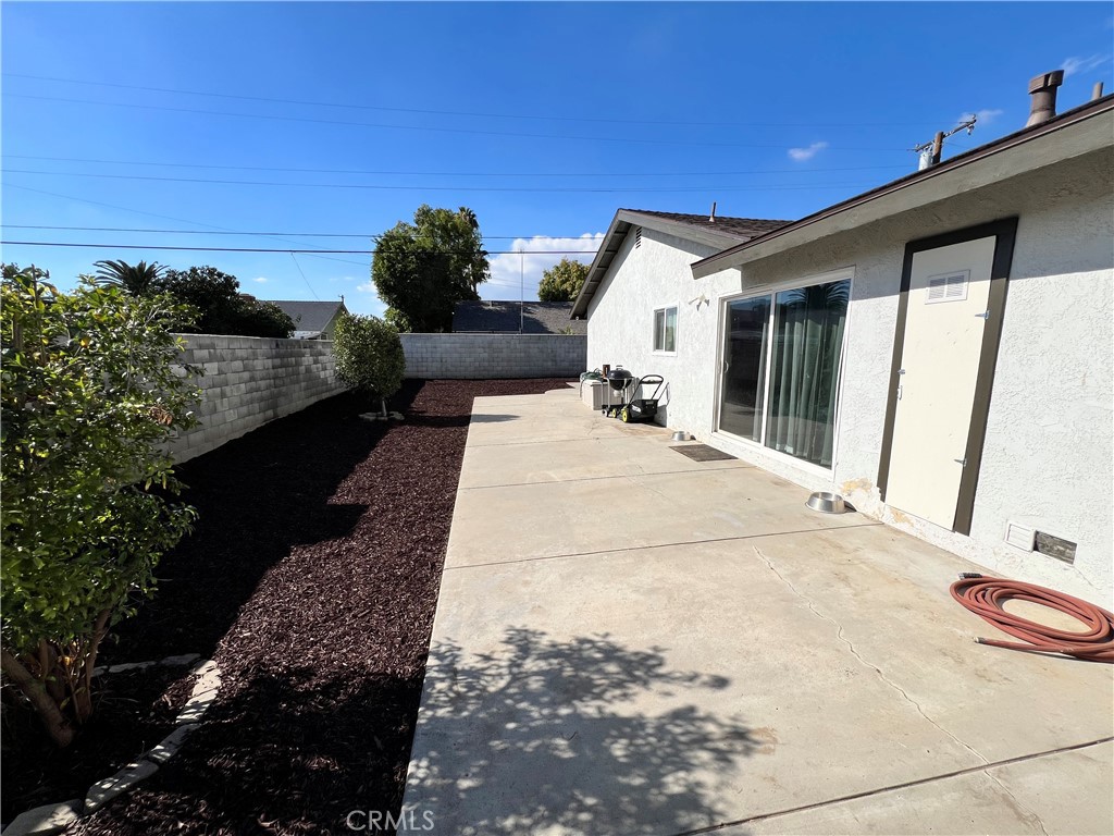 866 North Eucalyptus Avenue Rialto, CA 92376 - Photo 19 of 20 a view of a patio with table and chairs and potted plants