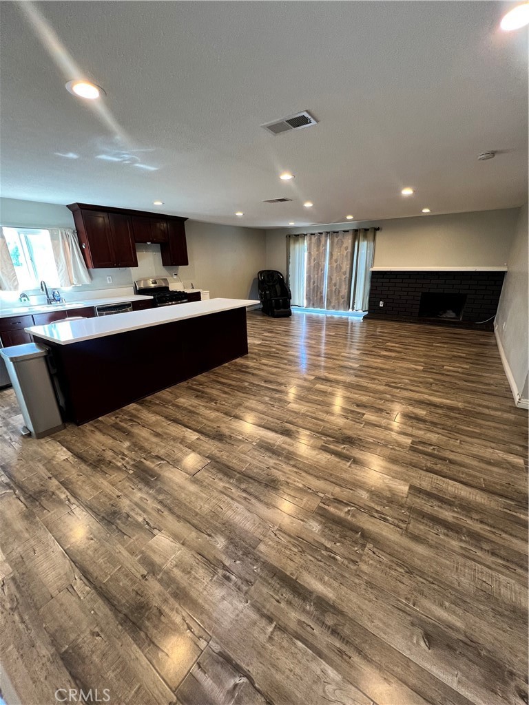 866 North Eucalyptus Avenue Rialto, CA 92376 - Photo 3 of 20 a view of room with kitchen island and stainless steel appliances