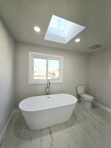 a bathroom with a toilet and sink
