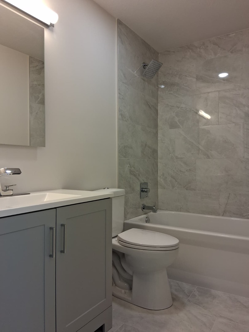 19013 Amlin Lane Country Club Hills, IL 60478 - Photo 16 of 20 a bathroom with a sink toilet and shower