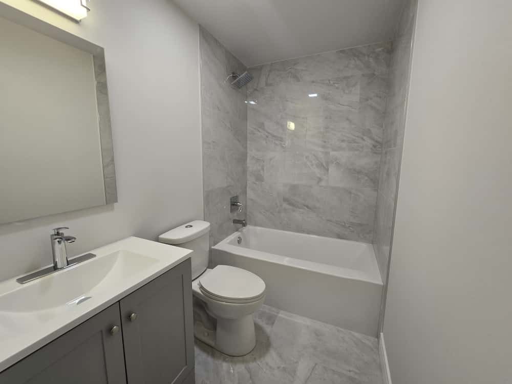 19013 Amlin Lane Country Club Hills, IL 60478 - Photo 17 of 20 a bathroom with a bathtub shower sink mirror and toilet