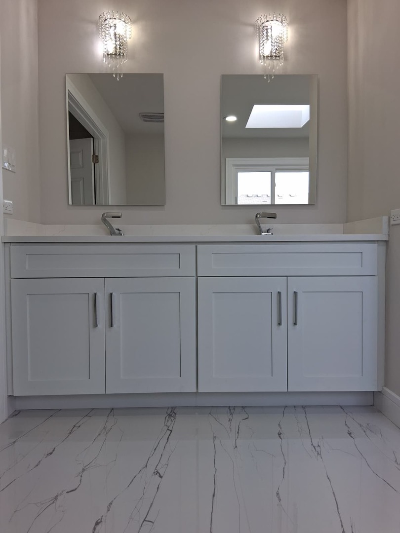 19013 Amlin Lane Country Club Hills, IL 60478 - Photo 10 of 20 a bathroom with a sink vanity and mirror