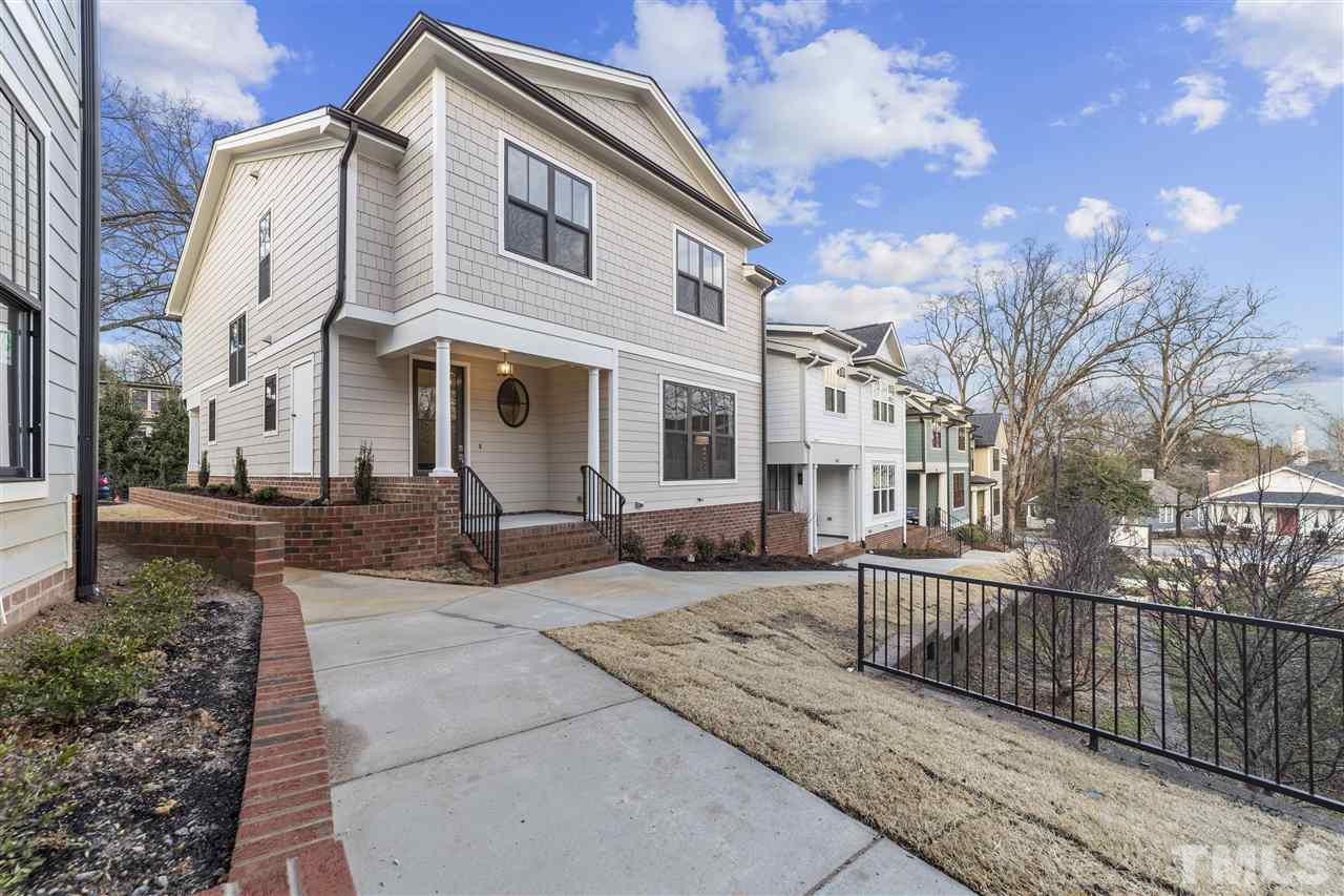 507 Hamilton Cottage Way Raleigh, NC 27605 - Photo 1 of 30 a front view of a house with a yard