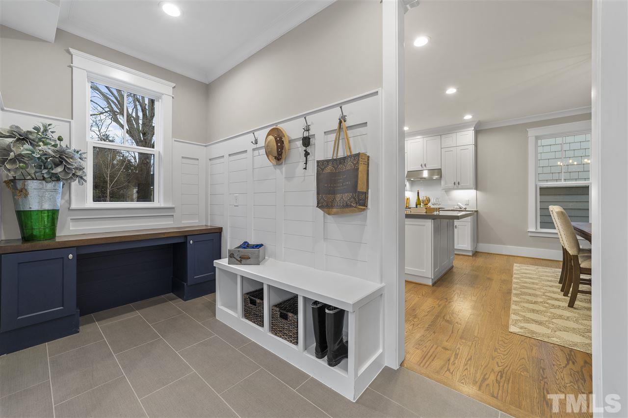507 Hamilton Cottage Way Raleigh, NC 27605 - Photo 13 of 30 a kitchen with a refrigerator and a sink