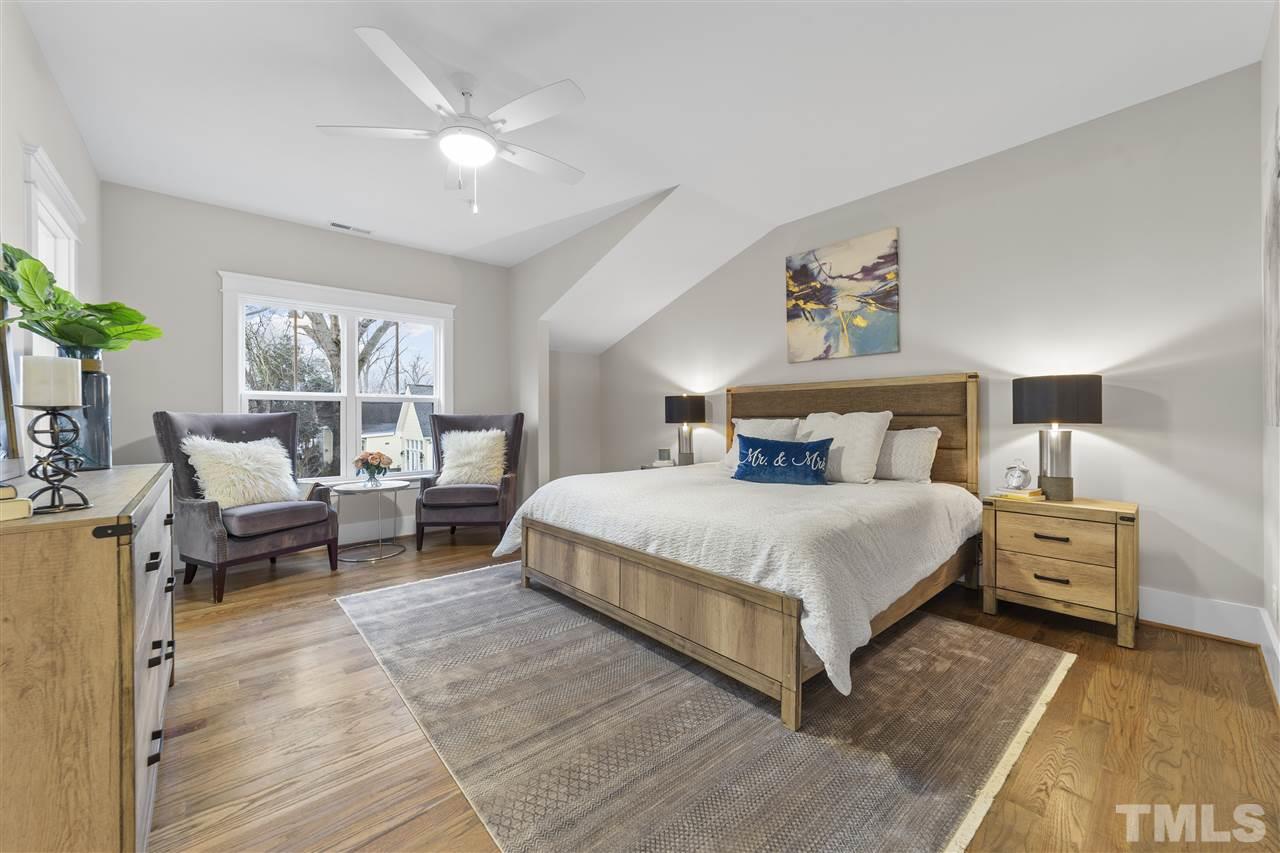 507 Hamilton Cottage Way Raleigh, NC 27605 - Photo 15 of 30 a bedroom with a bed and a couch