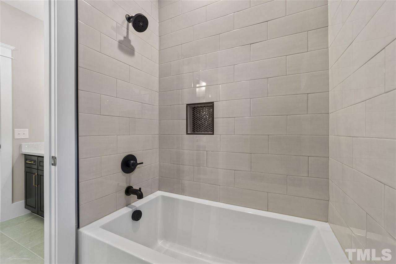 507 Hamilton Cottage Way Raleigh, NC 27605 - Photo 21 of 30 a bathroom with a bathtub