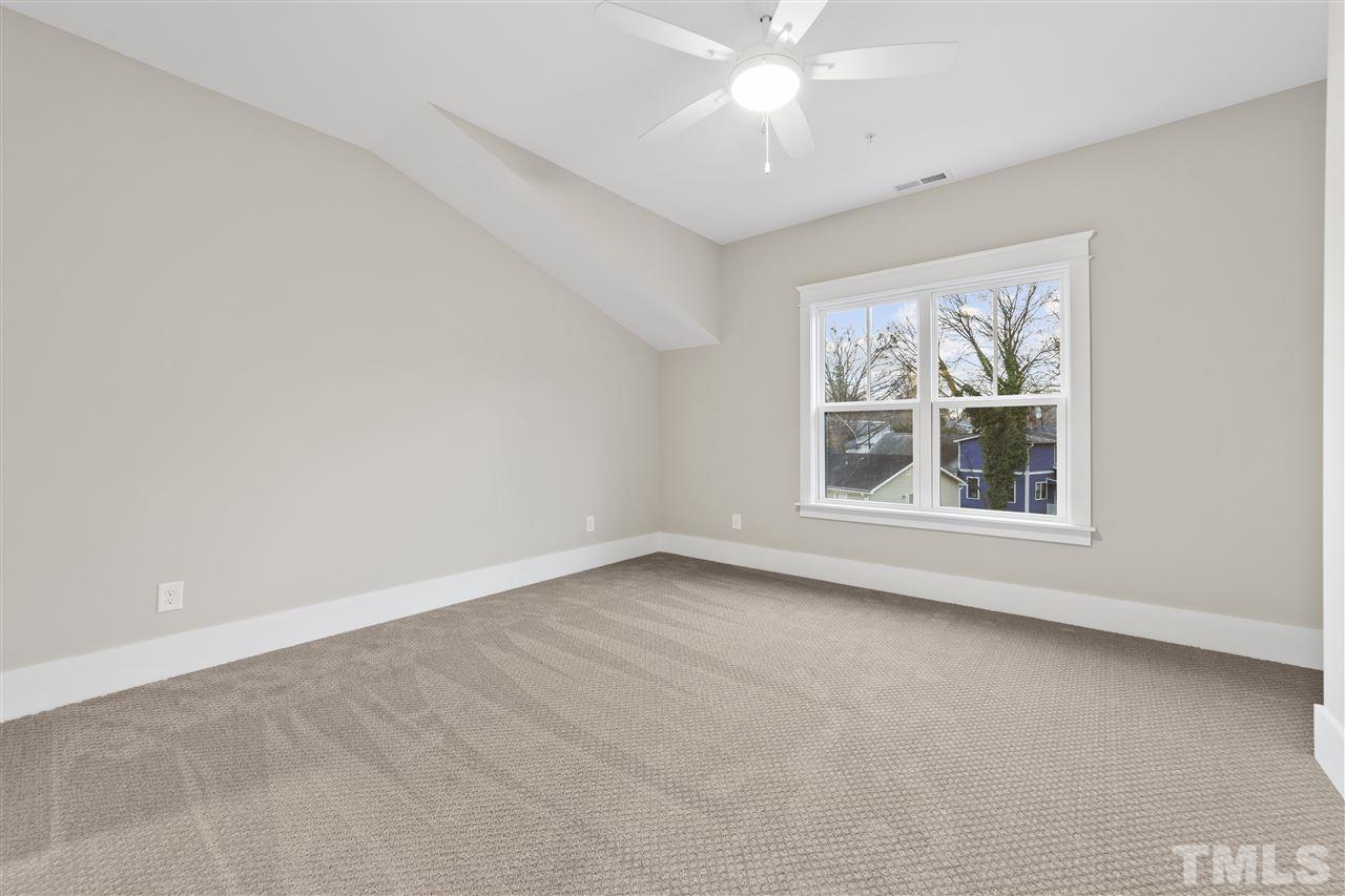 507 Hamilton Cottage Way Raleigh, NC 27605 - Photo 22 of 30 an empty room with a window