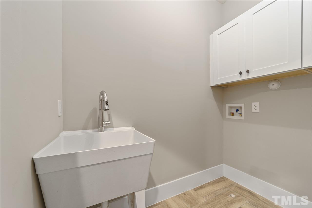 507 Hamilton Cottage Way Raleigh, NC 27605 - Photo 24 of 30 a bathroom with a sink and cabinets