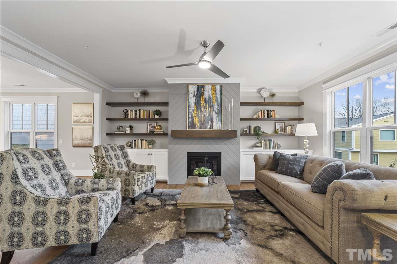507 Hamilton Cottage Way Raleigh, NC 27605 - Photo 5 of 30 a living room with furniture and a fireplace