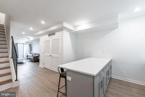 a view of a kitchen cabinets and wooden floor