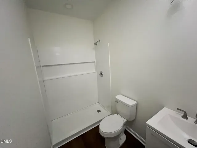 a bathroom with a toilet and a sink
