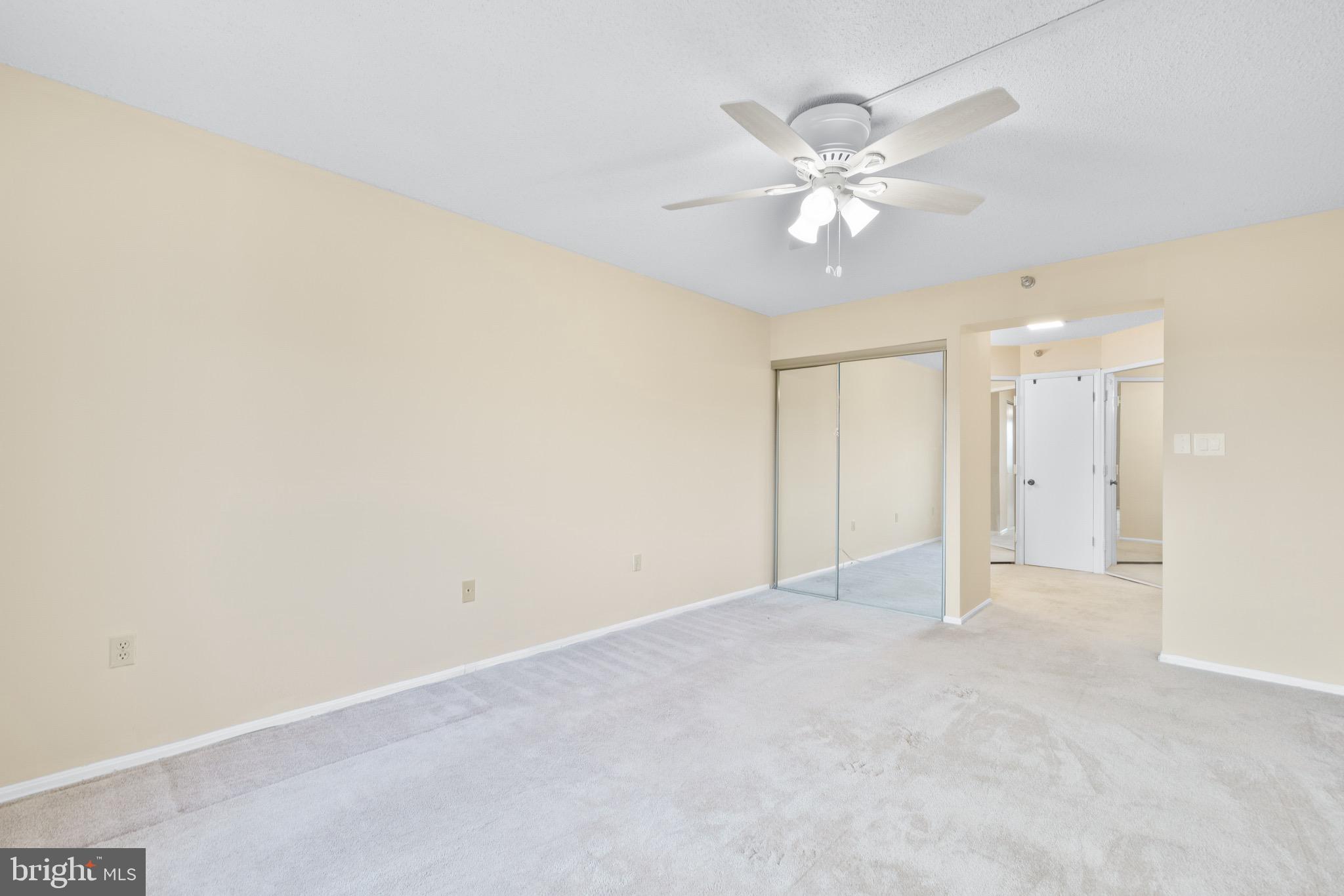 15115 Interlachen Drive, Unit 3607 Silver Spring, MD 20906 - Photo 13 of 37 an empty room with a fan and a fan