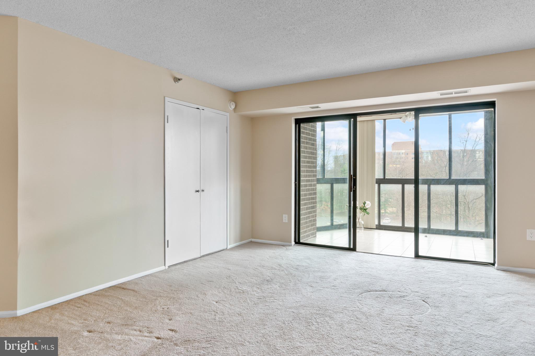 15115 Interlachen Drive, Unit 3607 Silver Spring, MD 20906 - Photo 18 of 37 a view of an empty room with a window