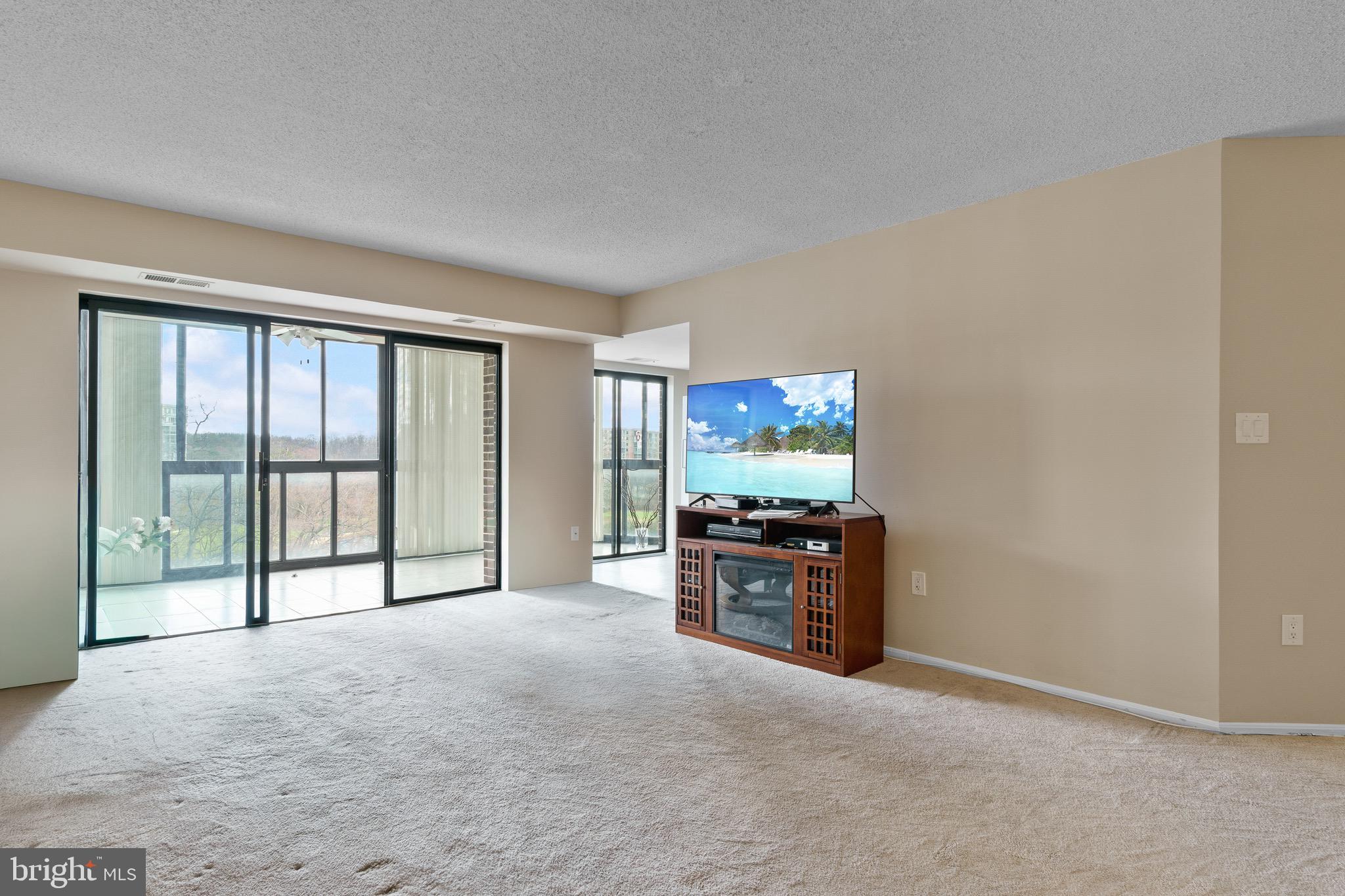 15115 Interlachen Drive, Unit 3607 Silver Spring, MD 20906 - Photo 19 of 37 a view of kitchen with furniture and large windows