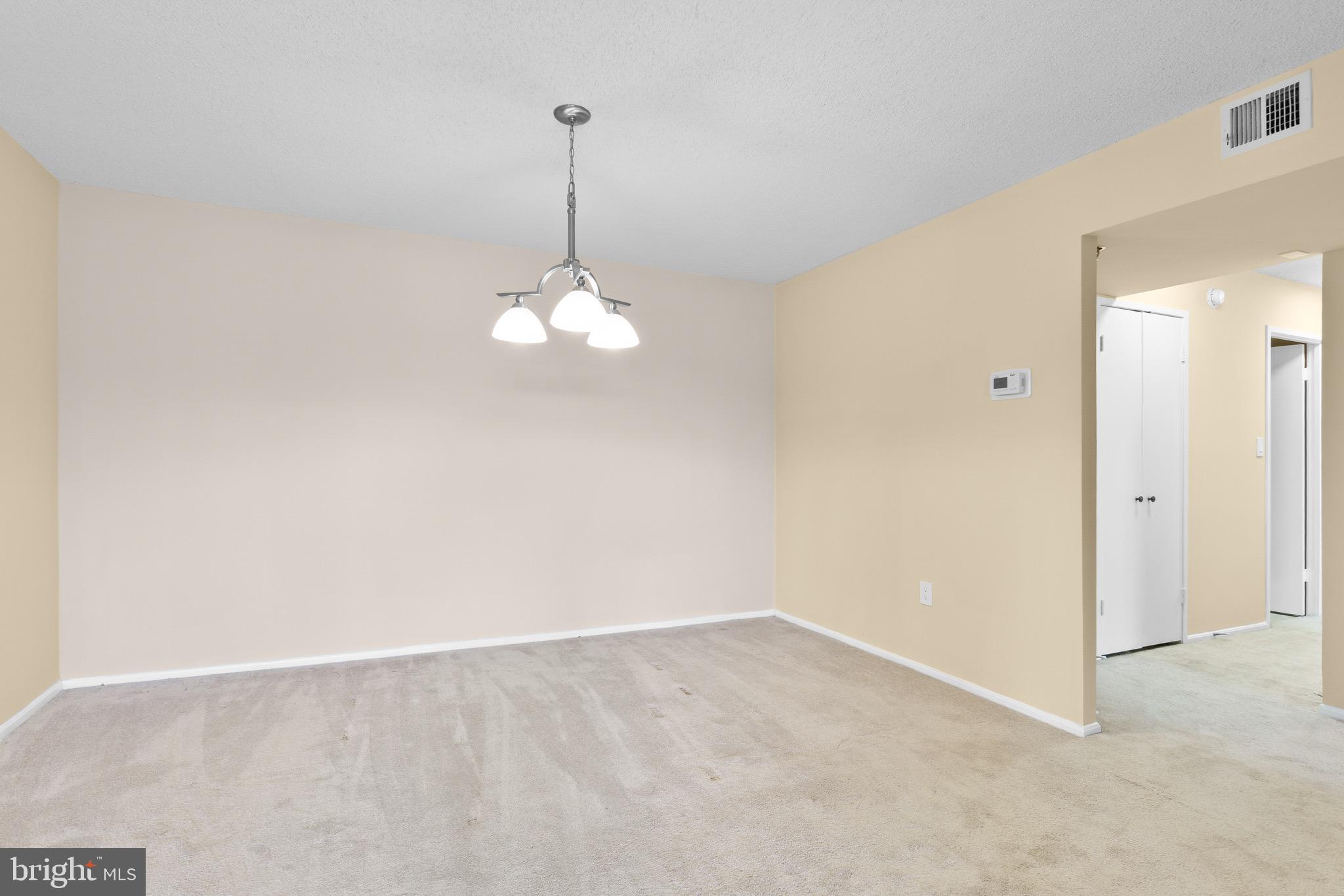 15115 Interlachen Drive, Unit 3607 Silver Spring, MD 20906 - Photo 20 of 37 a view of an empty room with a window