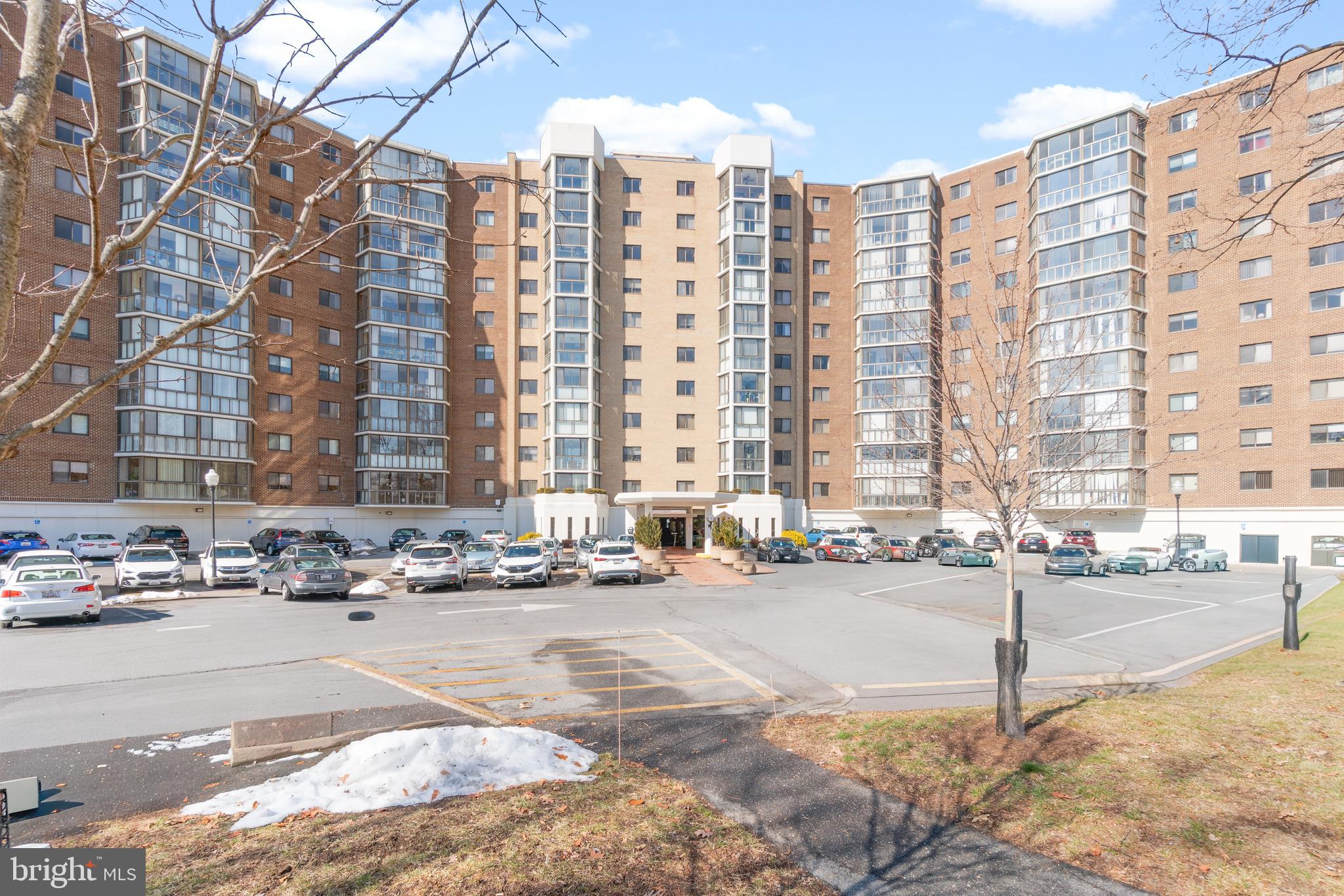 15115 Interlachen Drive, Unit 3607 Silver Spring, MD 20906 - Photo 2 of 37 a city street lined with tall buildings