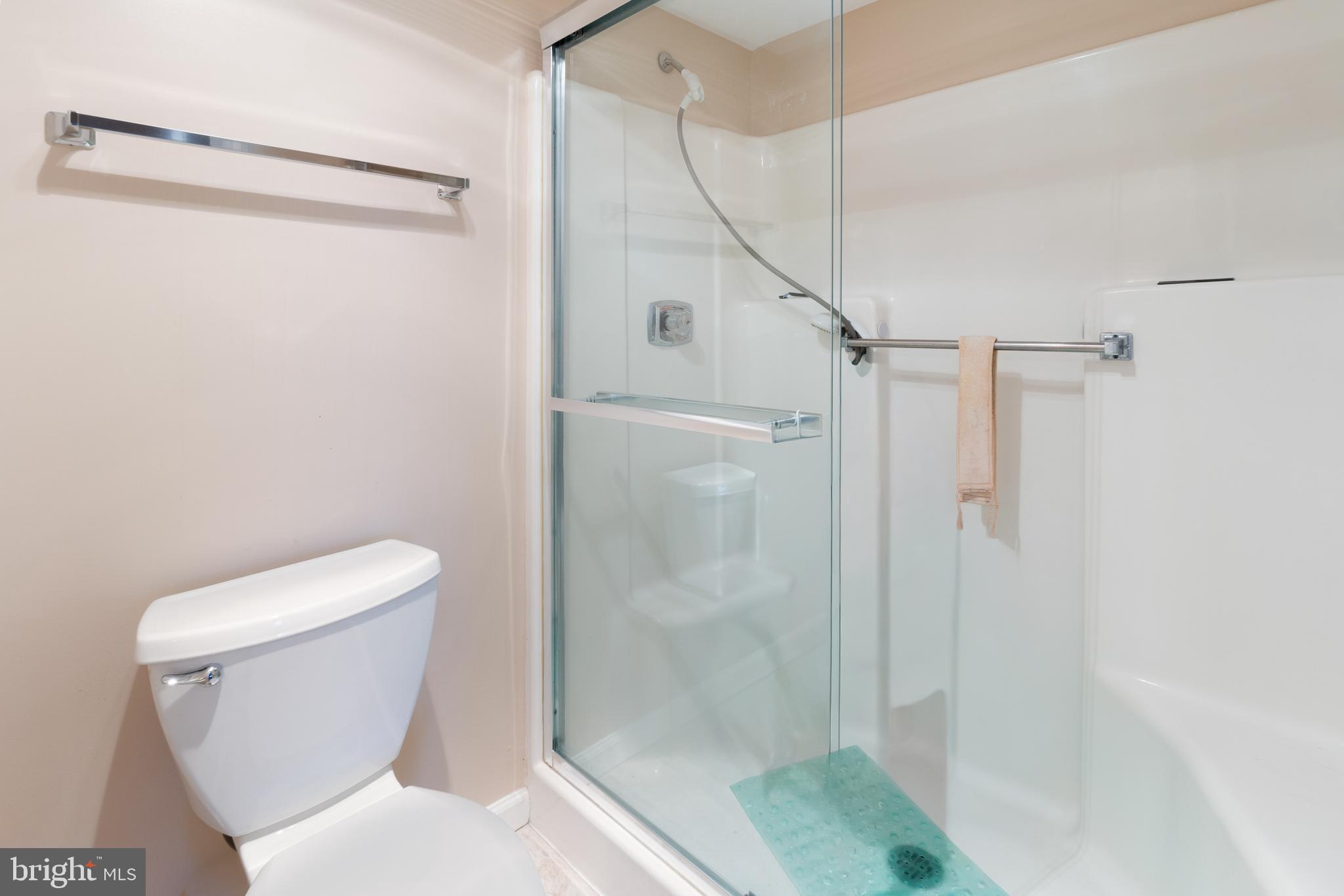 15115 Interlachen Drive, Unit 3607 Silver Spring, MD 20906 - Photo 24 of 37 a white toilet sitting next to a shower