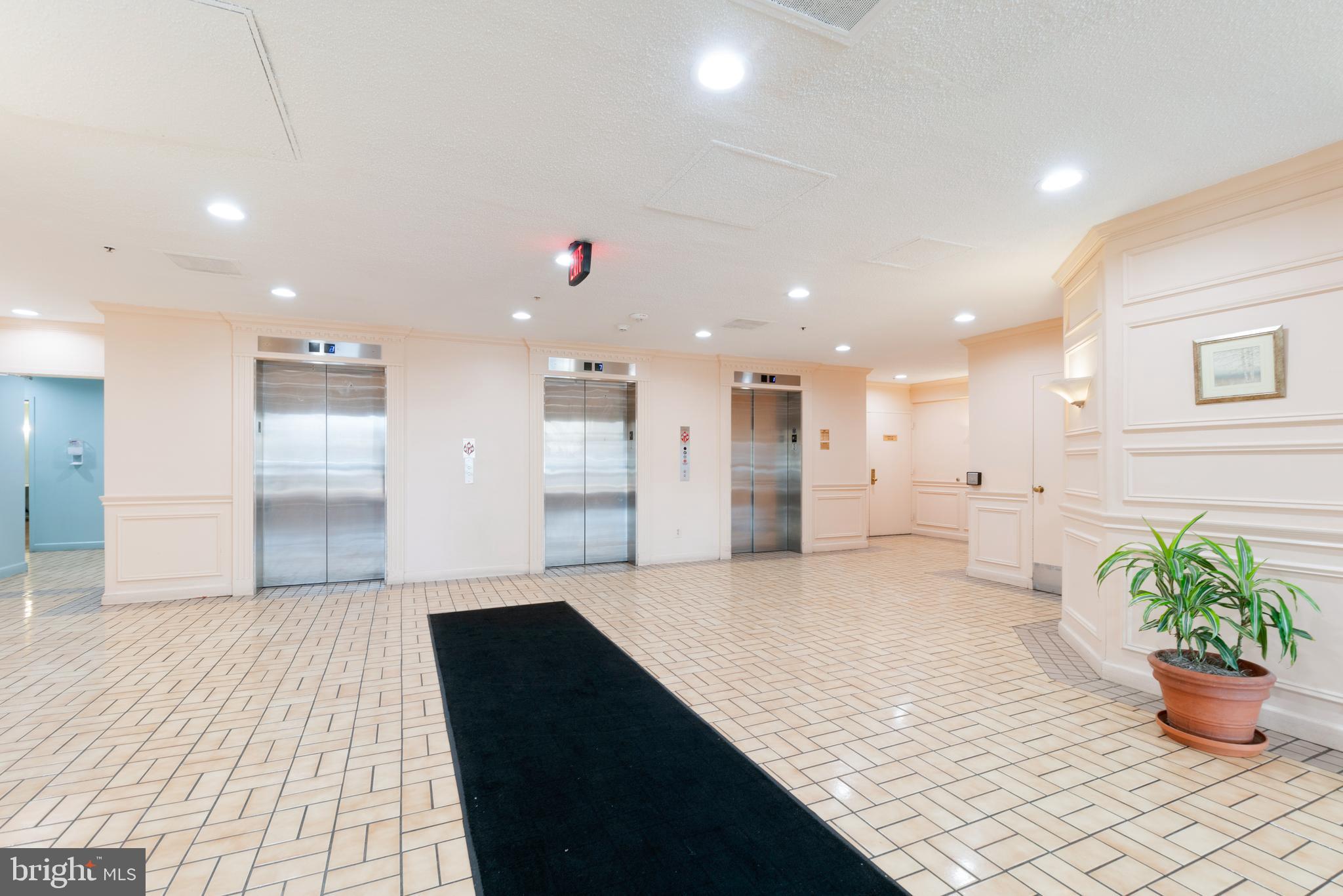 15115 Interlachen Drive, Unit 3607 Silver Spring, MD 20906 - Photo 26 of 37 a hallway with a large window