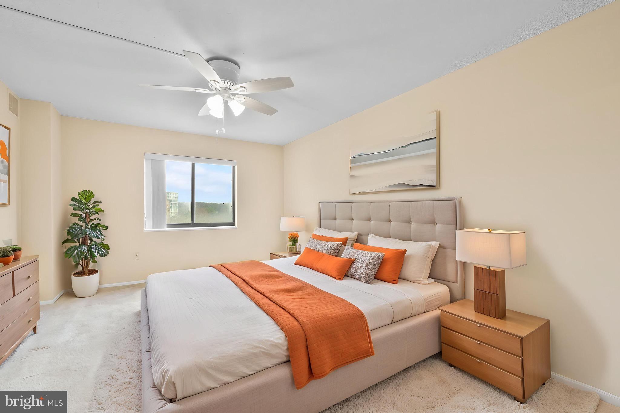 15115 Interlachen Drive, Unit 3607 Silver Spring, MD 20906 - Photo 4 of 37 a bedroom with bed and window