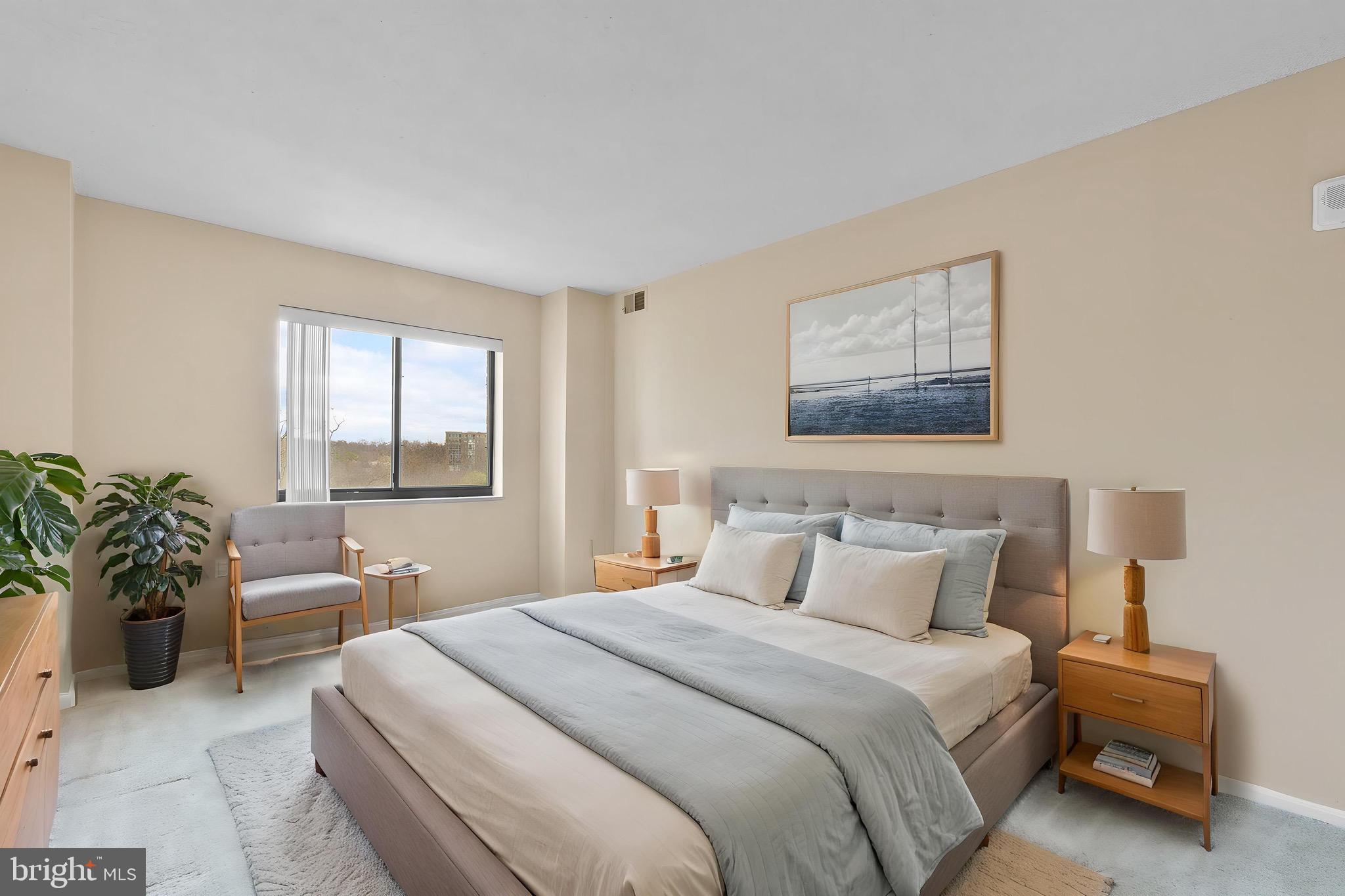 15115 Interlachen Drive, Unit 3607 Silver Spring, MD 20906 - Photo 5 of 37 a bedroom with a large bed and windows