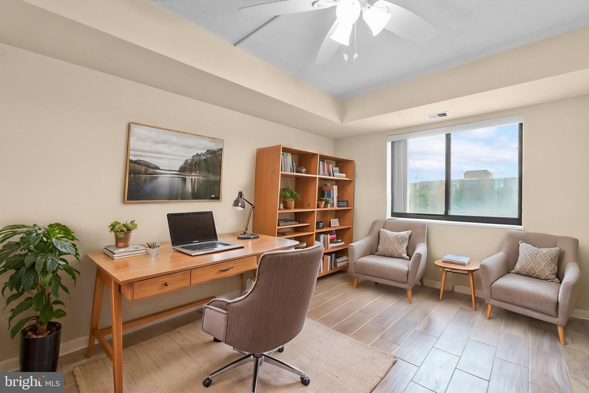 15115 Interlachen Drive, Unit 3607 Silver Spring, MD 20906 - Photo 6 of 37 a workspace with furniture and a potted plant