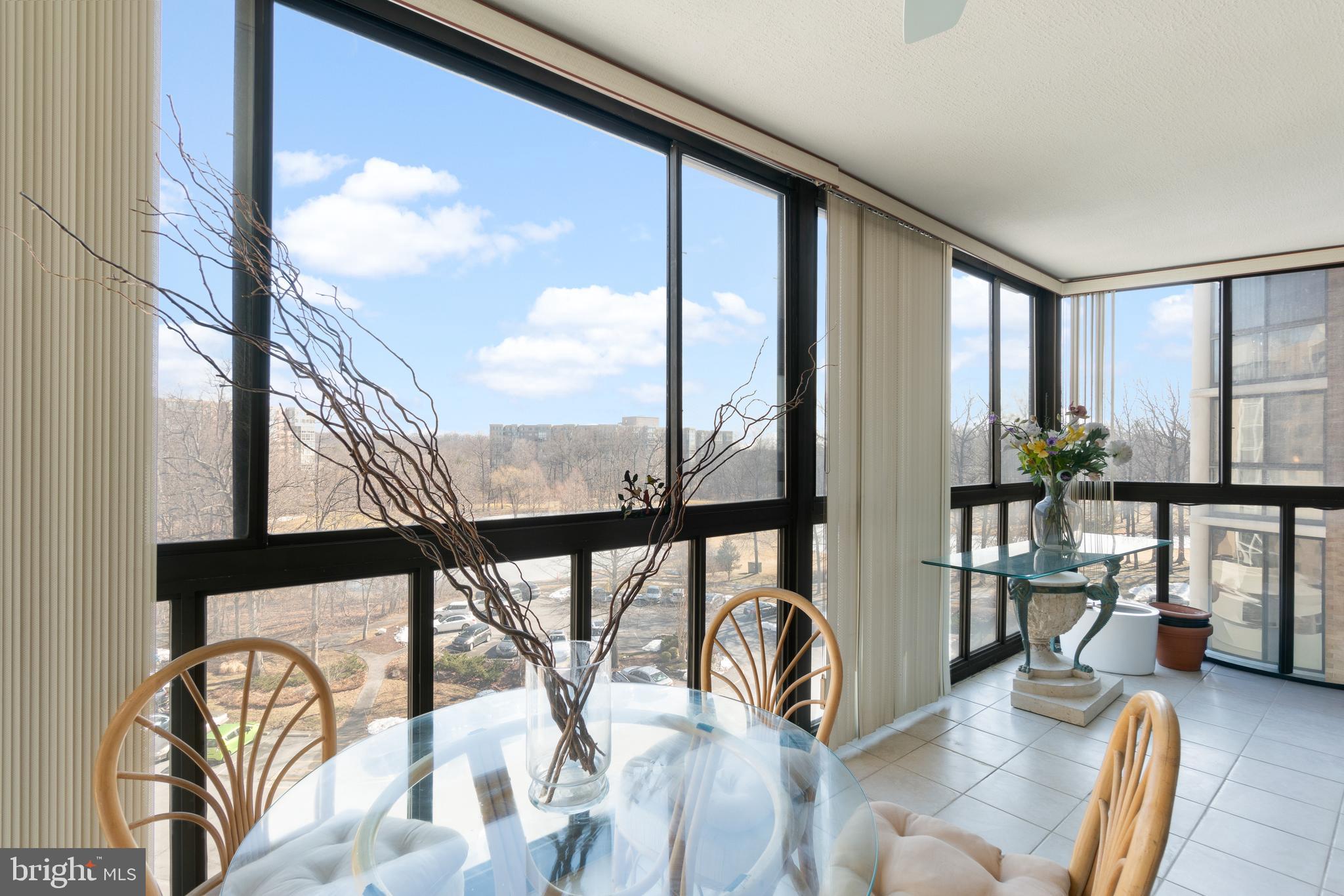 15115 Interlachen Drive, Unit 3607 Silver Spring, MD 20906 - Photo 9 of 37 a view of a living room with furniture and floor to ceiling window