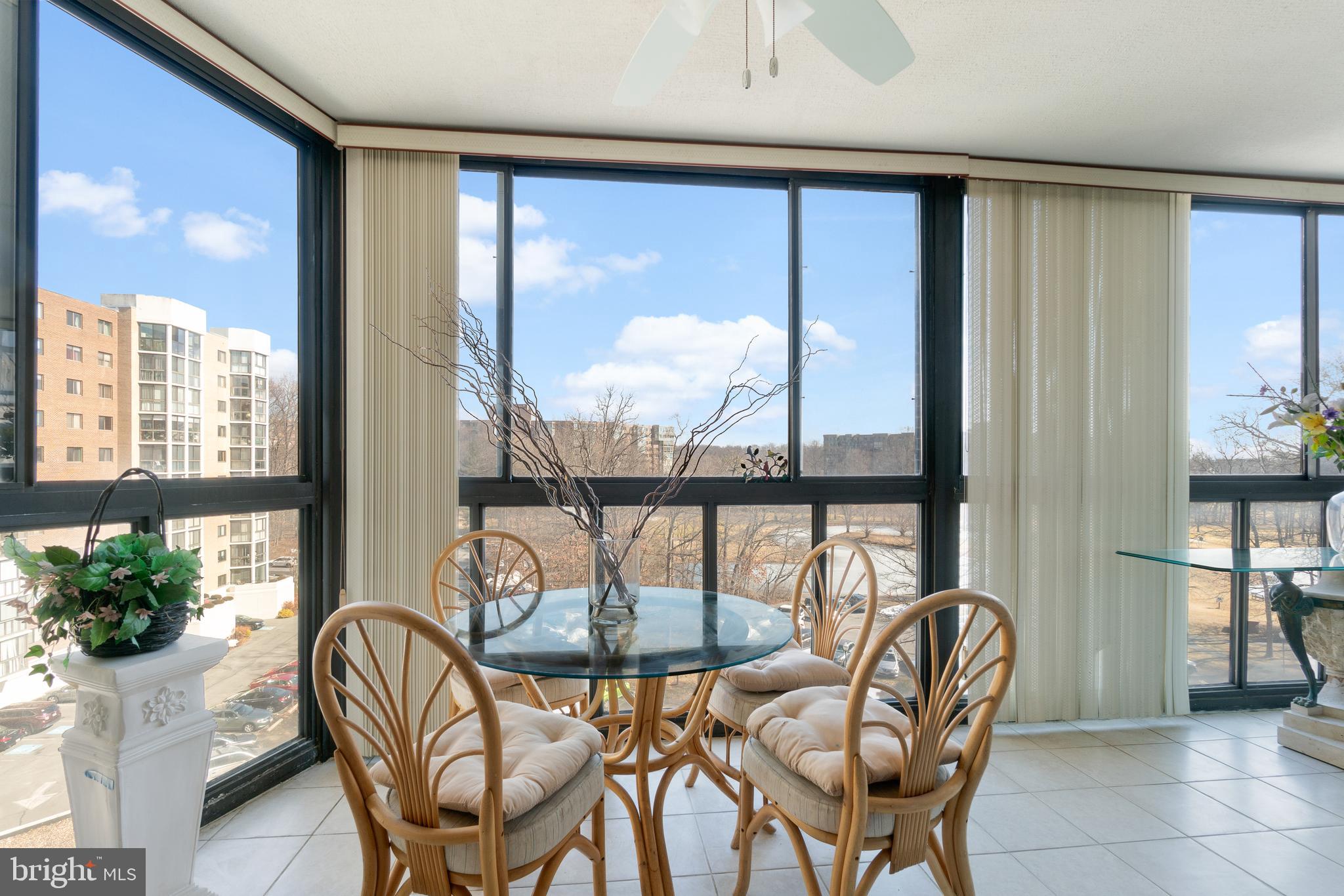15115 Interlachen Drive, Unit 3607 Silver Spring, MD 20906 - Photo 10 of 37 a dining room with furniture window and outside view