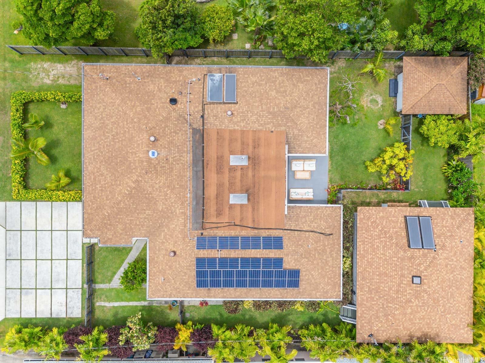 244 Awakea Road Kailua, HI 96734 - Photo 23 of 25 Aerial view of main house + attached cottage, detached ADU, and storage shed in back corner of the lot. 16 PV Solar Panels and 4 Solar Hot Water Panels.