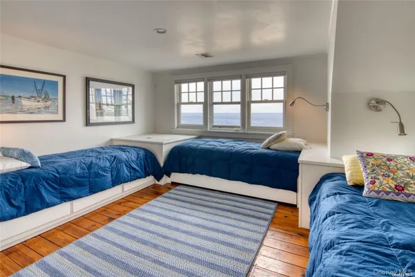 a bedroom with bed and window