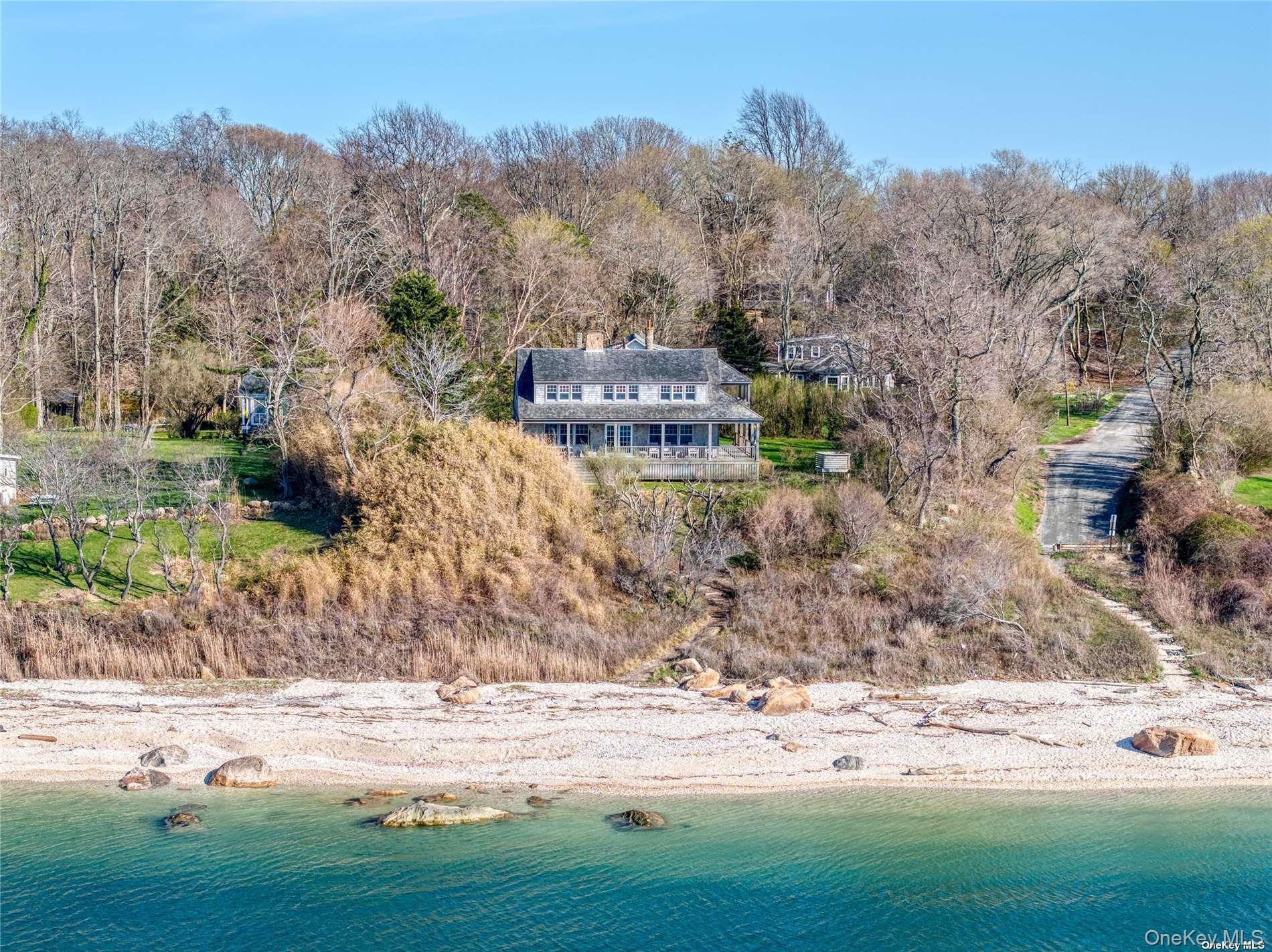 2100 Youngs Road Orient, NY 11957 - Photo 20 of 22 a front view of a house with a yard